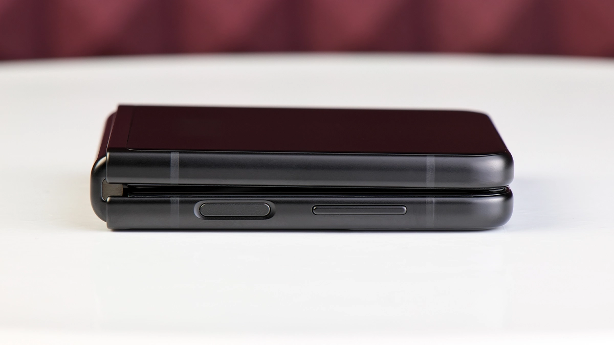 Black color flip phone on table